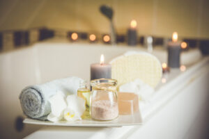 White ceramic tray with home spa supplies in home bathroom for relaxing rituals. 